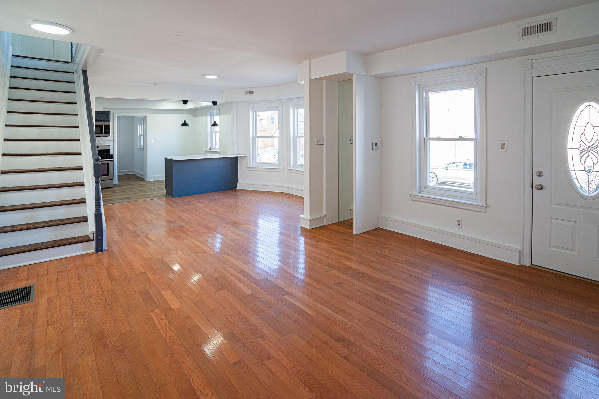 2540 East County Line Road Ardmore, PA 19003 - Photo 2 of 22 a view of empty room with wooden floor and window