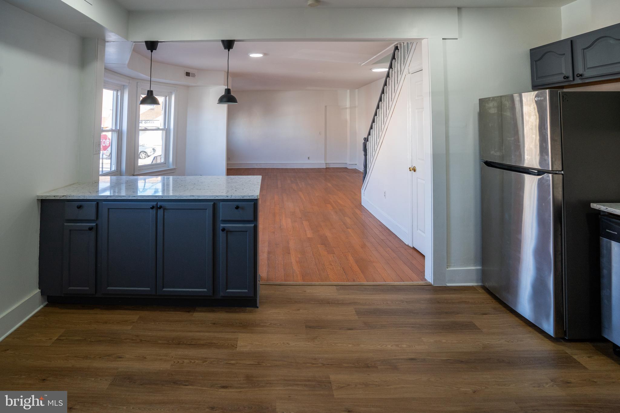 2540 East County Line Road Ardmore, PA 19003 - Photo 8 of 22 a view of a kitchen with wooden cabinet and a refrigerator