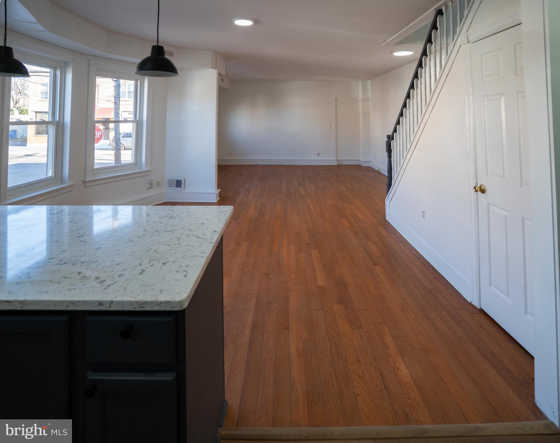 2540 East County Line Road Ardmore, PA 19003 - Photo 9 of 22 wooden floor in an empty room with wooden floor and staircase