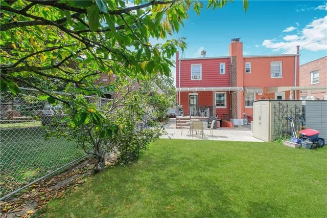a view of a building with a yard chair and table