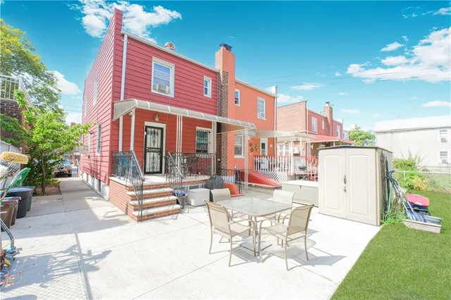 a view of a patio with couches table and chairs and potted plants