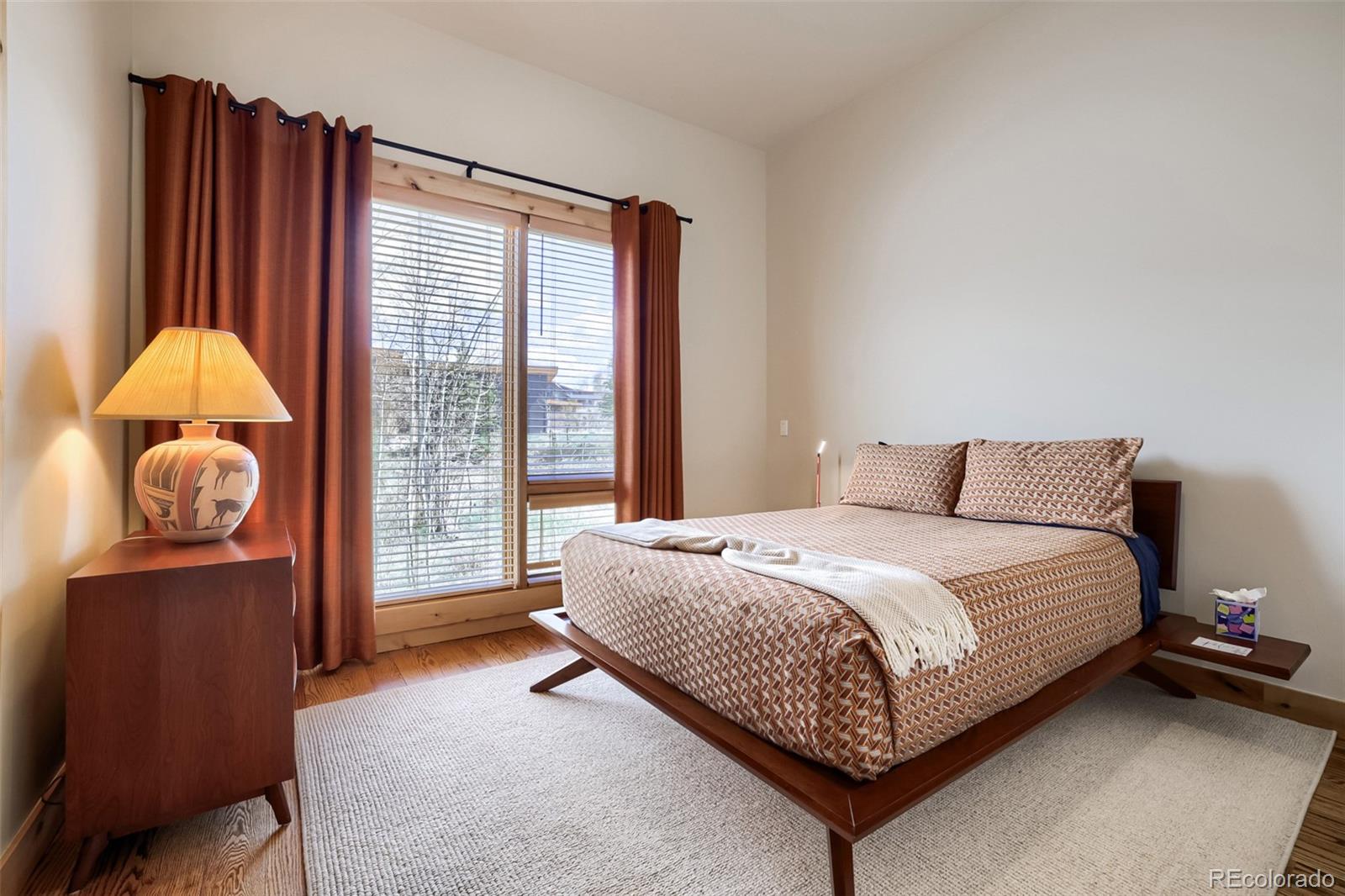 836 Maryland Creek Road Silverthorne, CO 80498 - Photo 13 of 49 a bed sitting in a bedroom next to a window