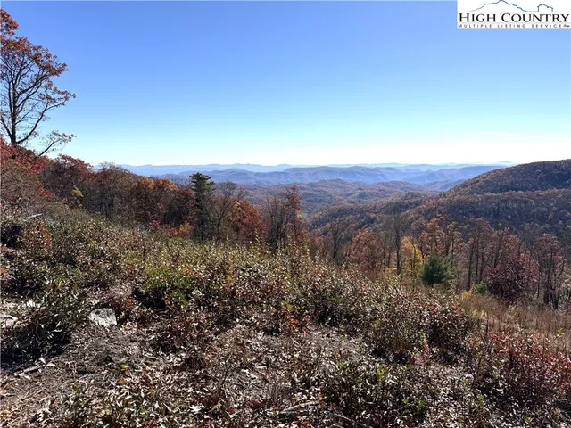 a view of a area with wooden fence