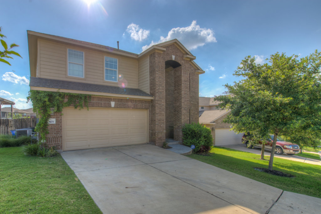 403 Limestone Trail Austin, TX 78737 - Photo 1 of 18 A classic brick and siding two-story home, with an attached garage and a well-kept front yard.