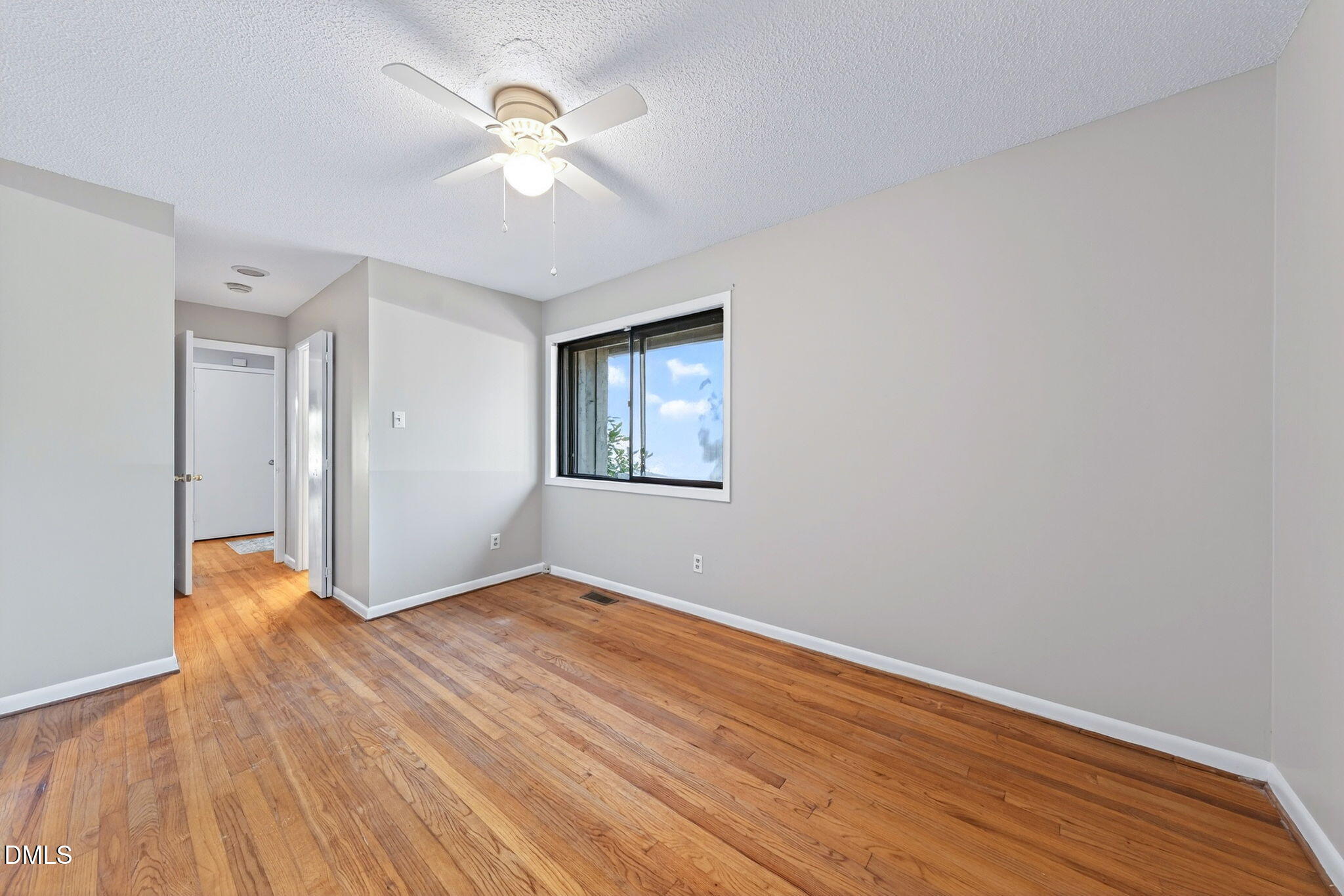 216 Ridge Trail Chapel Hill, NC 27516 - Photo 18 of 30 a view of an empty room with wooden floor