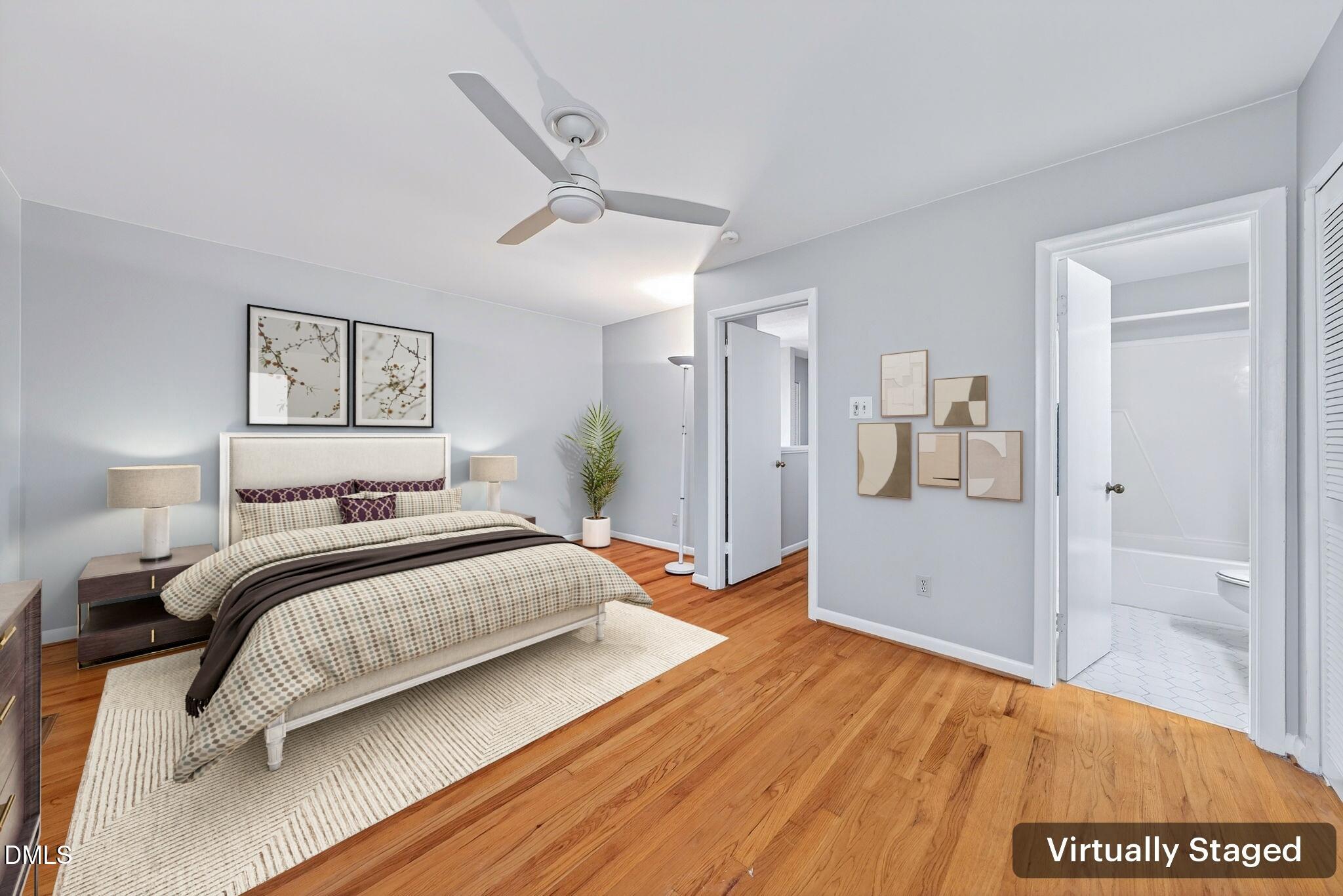 216 Ridge Trail Chapel Hill, NC 27516 - Photo 20 of 30 a bedroom with a bed and a painting on the wall