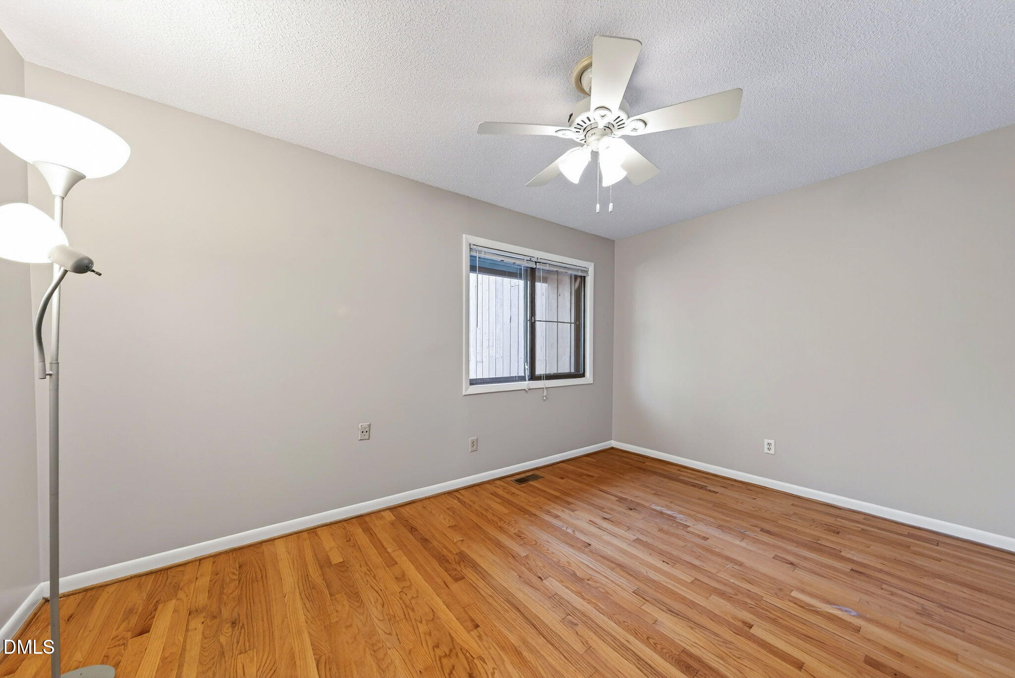 216 Ridge Trail Chapel Hill, NC 27516 - Photo 23 of 30 a view of a room with wooden floor and fan