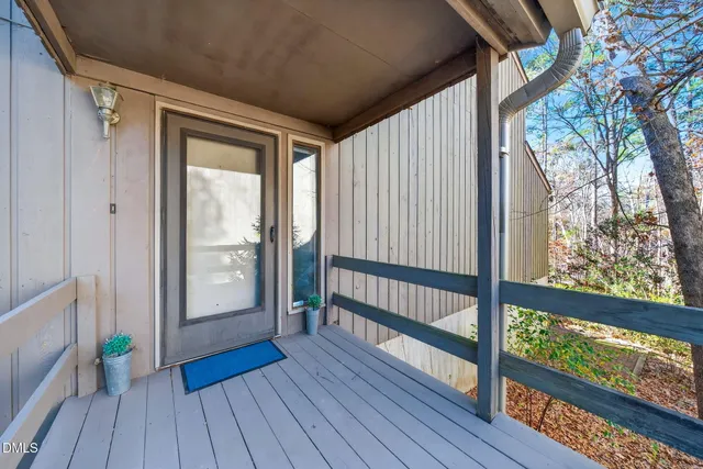 a view of hallway with wooden floor