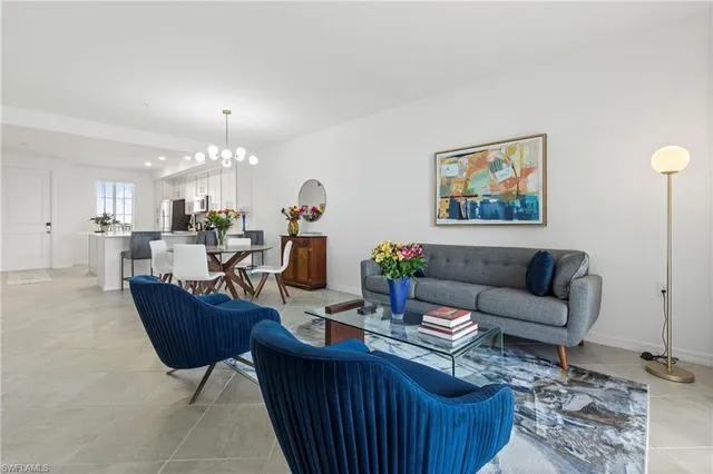 a bedroom with a white bed and a window