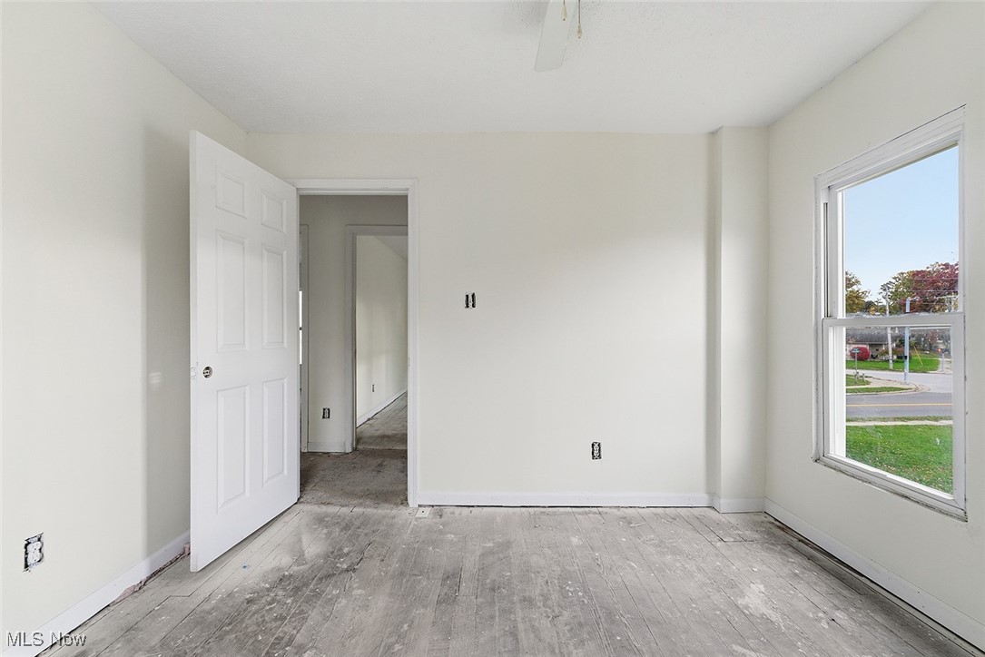 1206 Diagonal Road Akron, OH 44320 - Photo 22 of 28 Unfurnished room featuring hardwood / wood-style floors and ceiling fan
