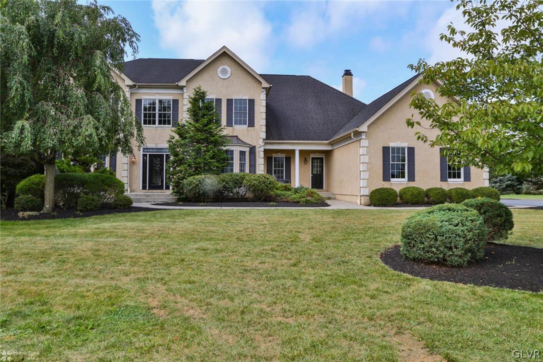 577 Rockbridge Road Nazareth, PA 18064 - Photo 1 of 50 a front view of a house with a garden