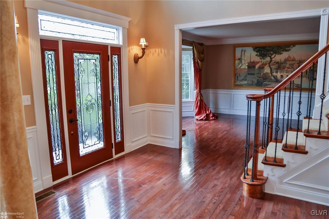 577 Rockbridge Road Nazareth, PA 18064 - Photo 5 of 50 a view of a hallway with wooden floor and stairs