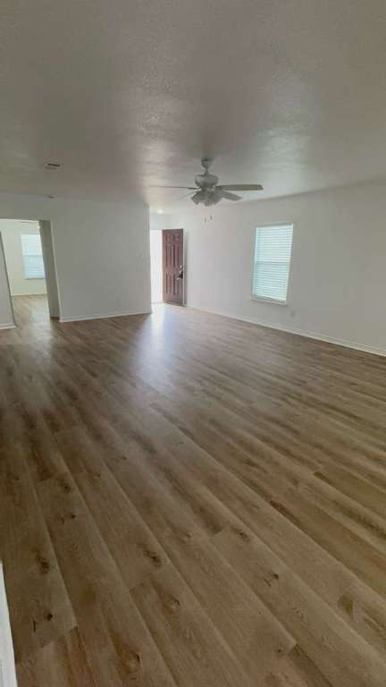 14205 Prairie Sod Lane Elgin, TX 78621 - Photo 19 of 24 a view of a room with an empty space and a window