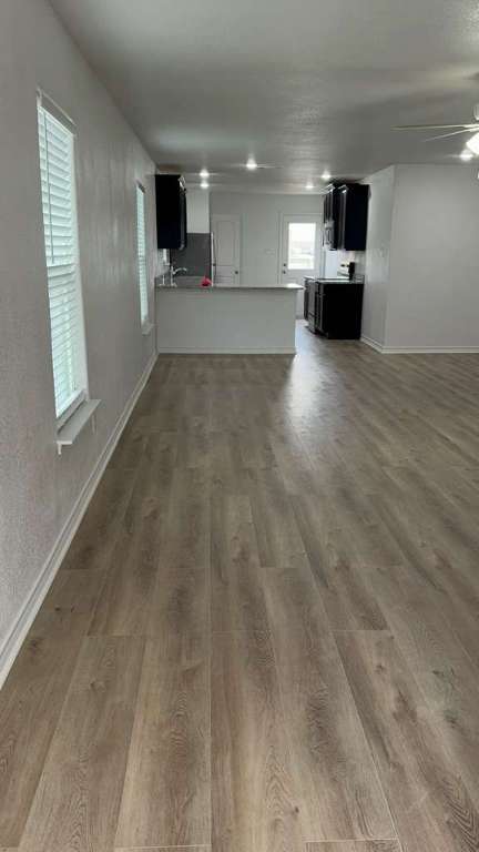 14205 Prairie Sod Lane Elgin, TX 78621 - Photo 2 of 24 a view of a livingroom with a kitchen