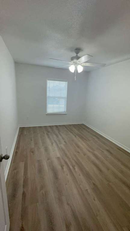 14205 Prairie Sod Lane Elgin, TX 78621 - Photo 20 of 24 wooden floor in an empty room