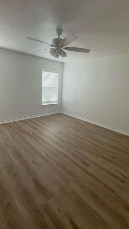 14205 Prairie Sod Lane Elgin, TX 78621 - Photo 8 of 24 wooden floor in an empty room