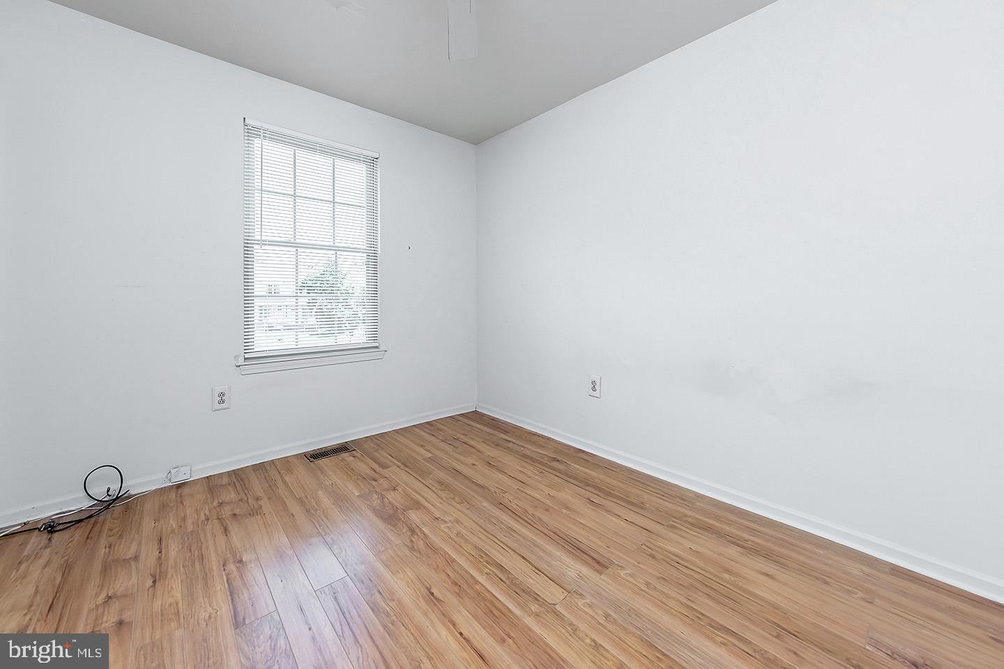 4 Shira Court Mount Holly, NJ 08060 - Photo 13 of 16 an empty room with wooden floor and windows