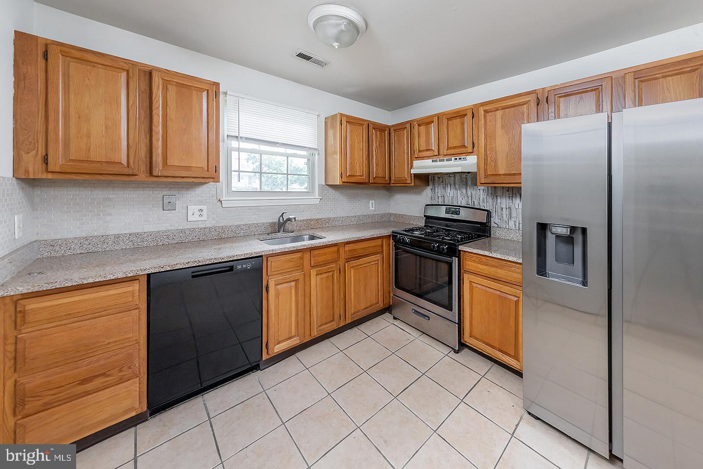 4 Shira Court Mount Holly, NJ 08060 - Photo 3 of 16 a kitchen with stainless steel appliances granite countertop a refrigerator sink and cabinets