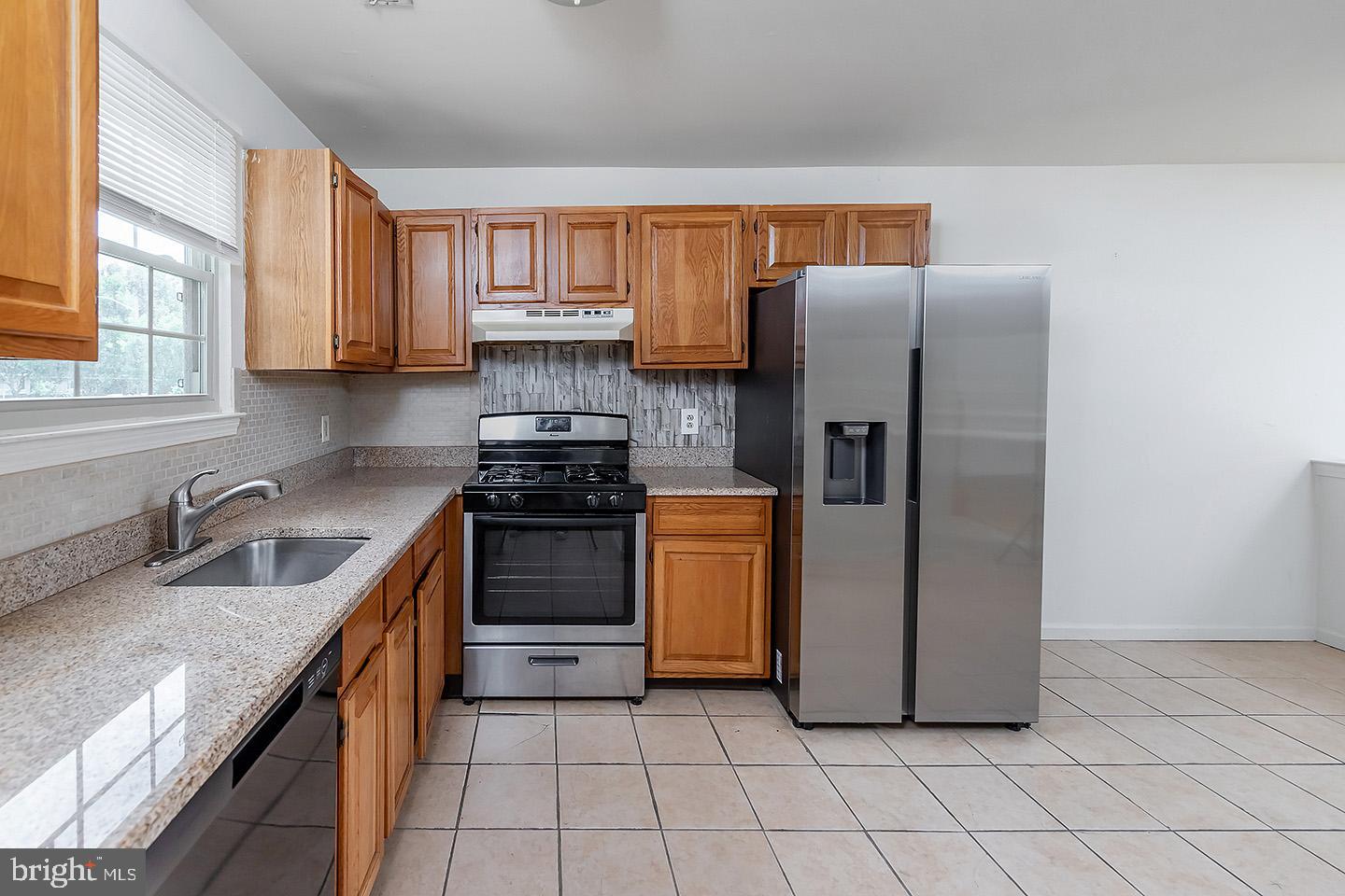 4 Shira Court Mount Holly, NJ 08060 - Photo 4 of 16 a kitchen with stainless steel appliances granite countertop a refrigerator a stove a sink and dishwasher