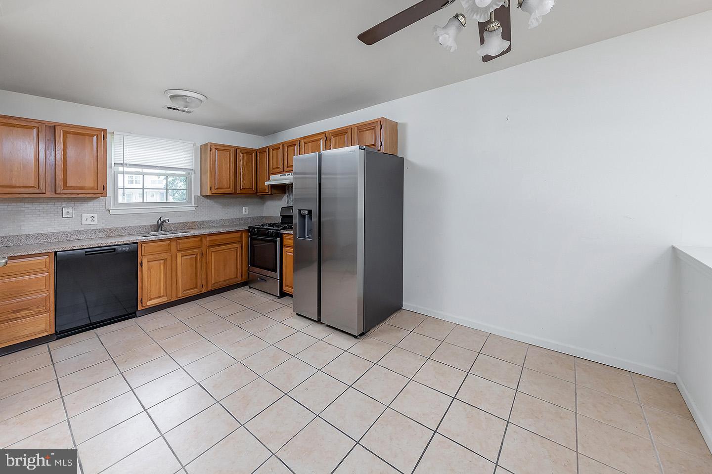 4 Shira Court Mount Holly, NJ 08060 - Photo 5 of 16 a kitchen with stainless steel appliances granite countertop a refrigerator and a sink