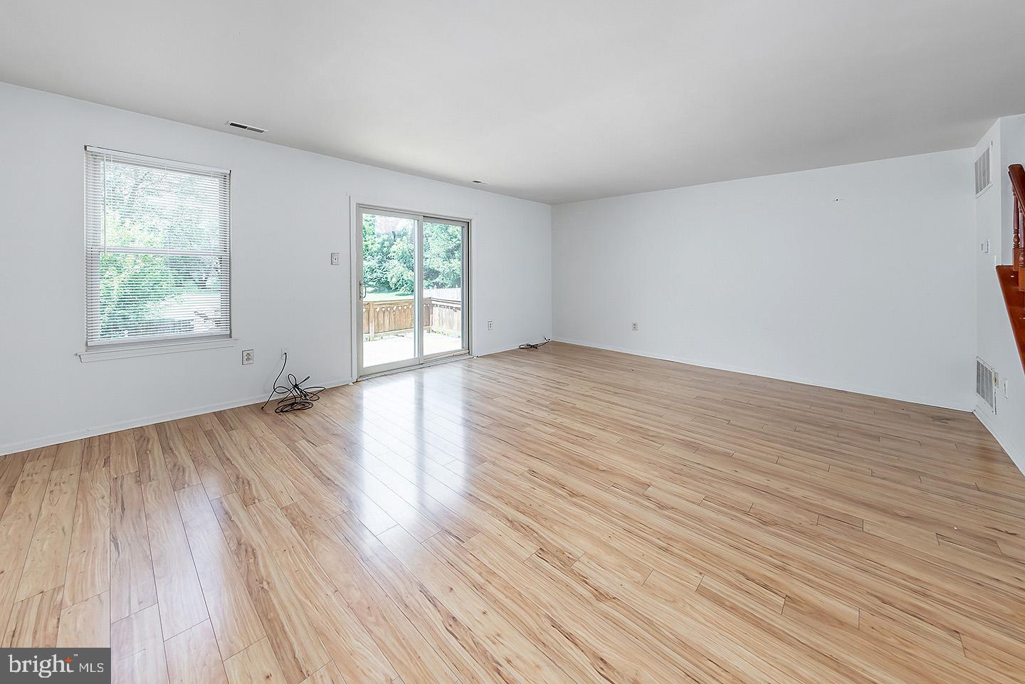 4 Shira Court Mount Holly, NJ 08060 - Photo 7 of 16 an empty room with wooden floor and windows