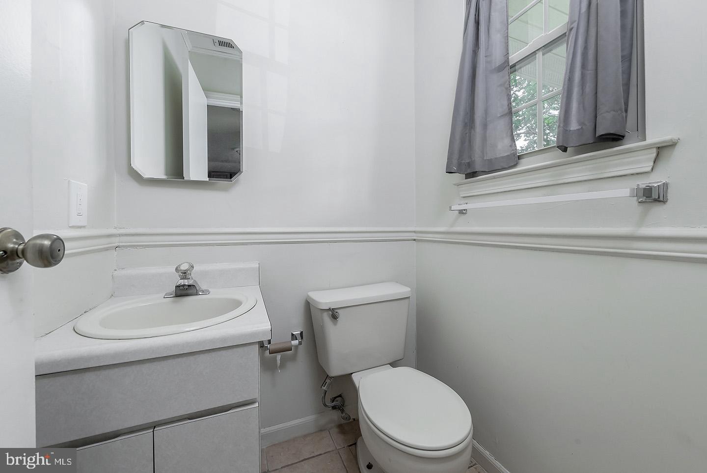 4 Shira Court Mount Holly, NJ 08060 - Photo 8 of 16 a bathroom with a toilet sink and mirror