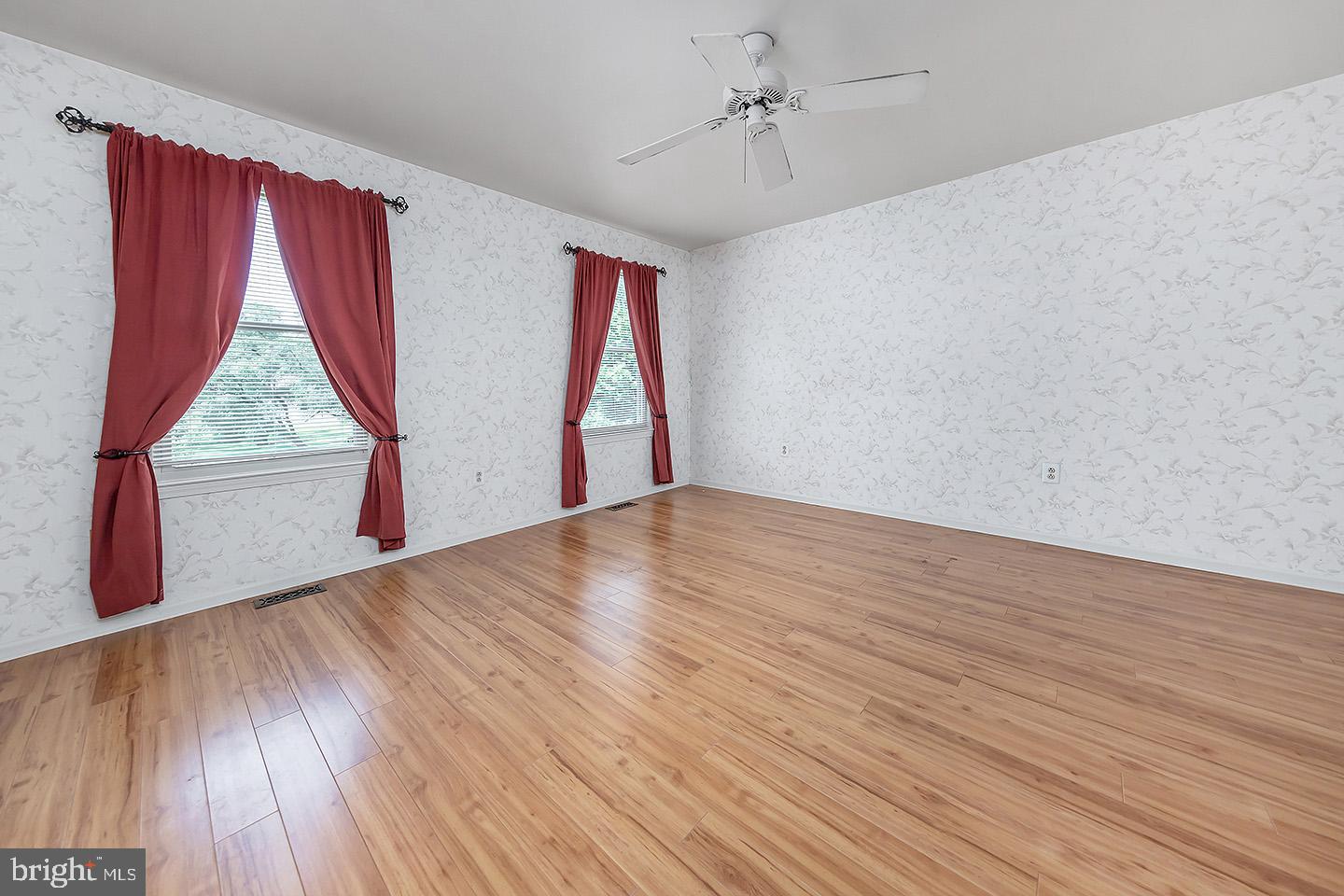 4 Shira Court Mount Holly, NJ 08060 - Photo 9 of 16 a view of empty room with wooden floor and fan