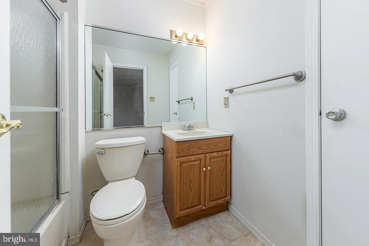 4 Shira Court Mount Holly, NJ 08060 - Photo 10 of 16 a bathroom with a toilet sink and mirror