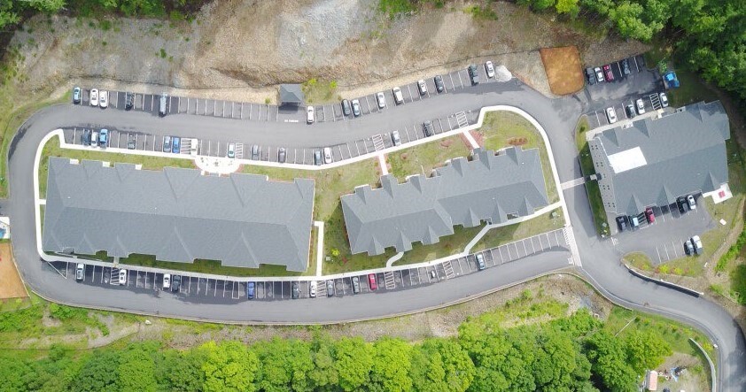 92 North Main Street, Unit C204 West Boylston, MA 01583 - Photo 2 of 3 a view of swimming pool with a yard