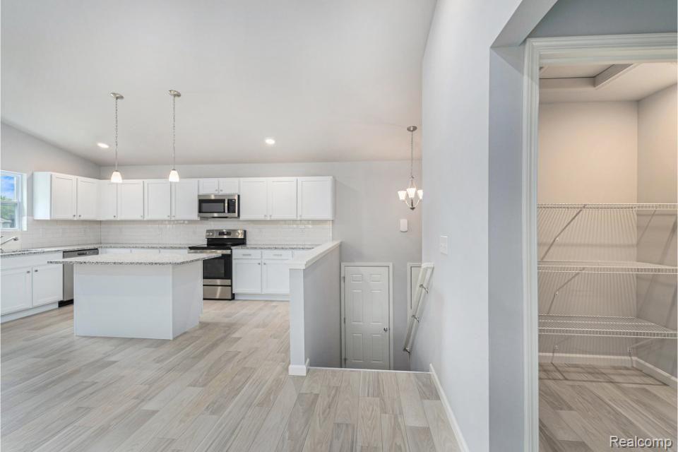 250 Joy Road Adrian, MI 49221 - Photo 3 of 32 Upper level has vaulted great room/kitchen