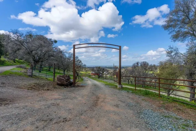 a view of a field with sitting area