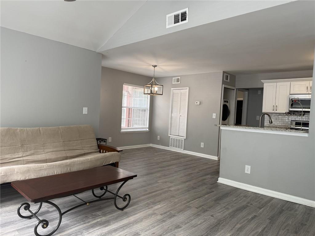 105 Hawkstone Way Alpharetta, GA 30022 - Photo 9 of 23 a workspace with wooden floor and a window