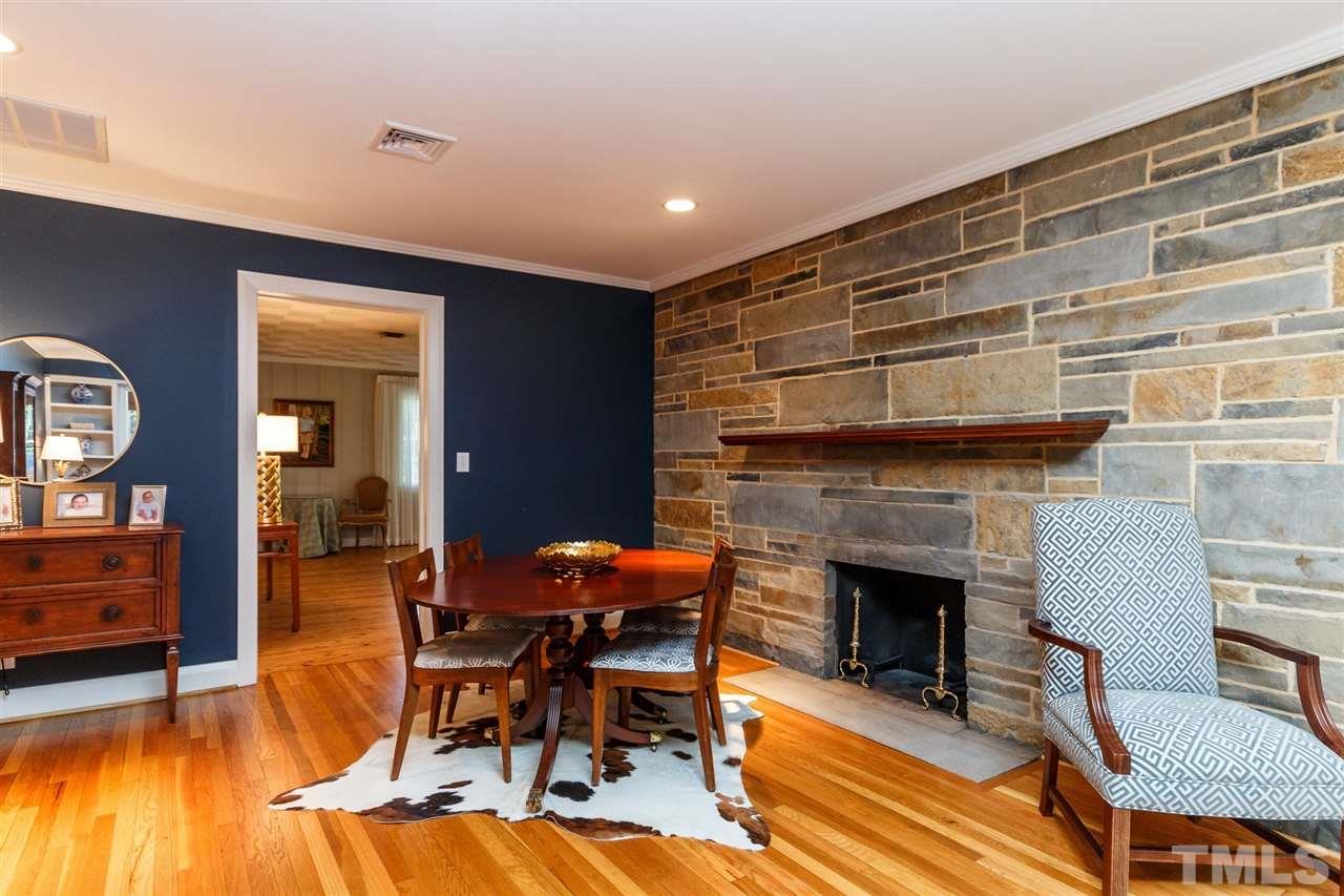 2509 Wake Drive Raleigh, NC 27608 - Photo 8 of 25 a living room with furniture and a fireplace