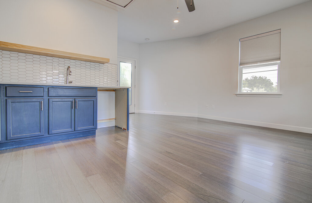 2406 East 16th Street Austin, TX 78702 - Photo 34 of 39 an empty room with wooden floor and window