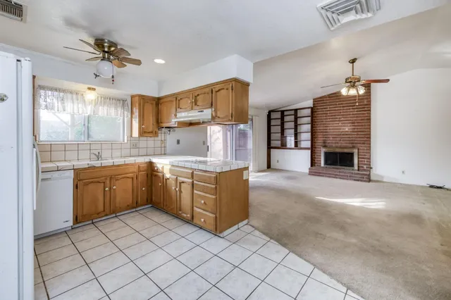 a kitchen with a cabinets and window