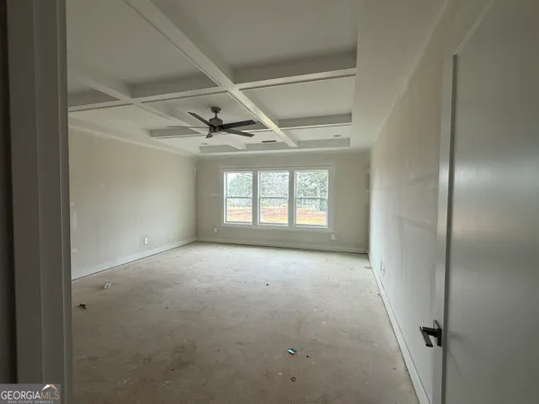 a view of a house with a yard and a lake