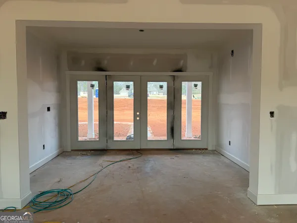 a view of empty room with windows