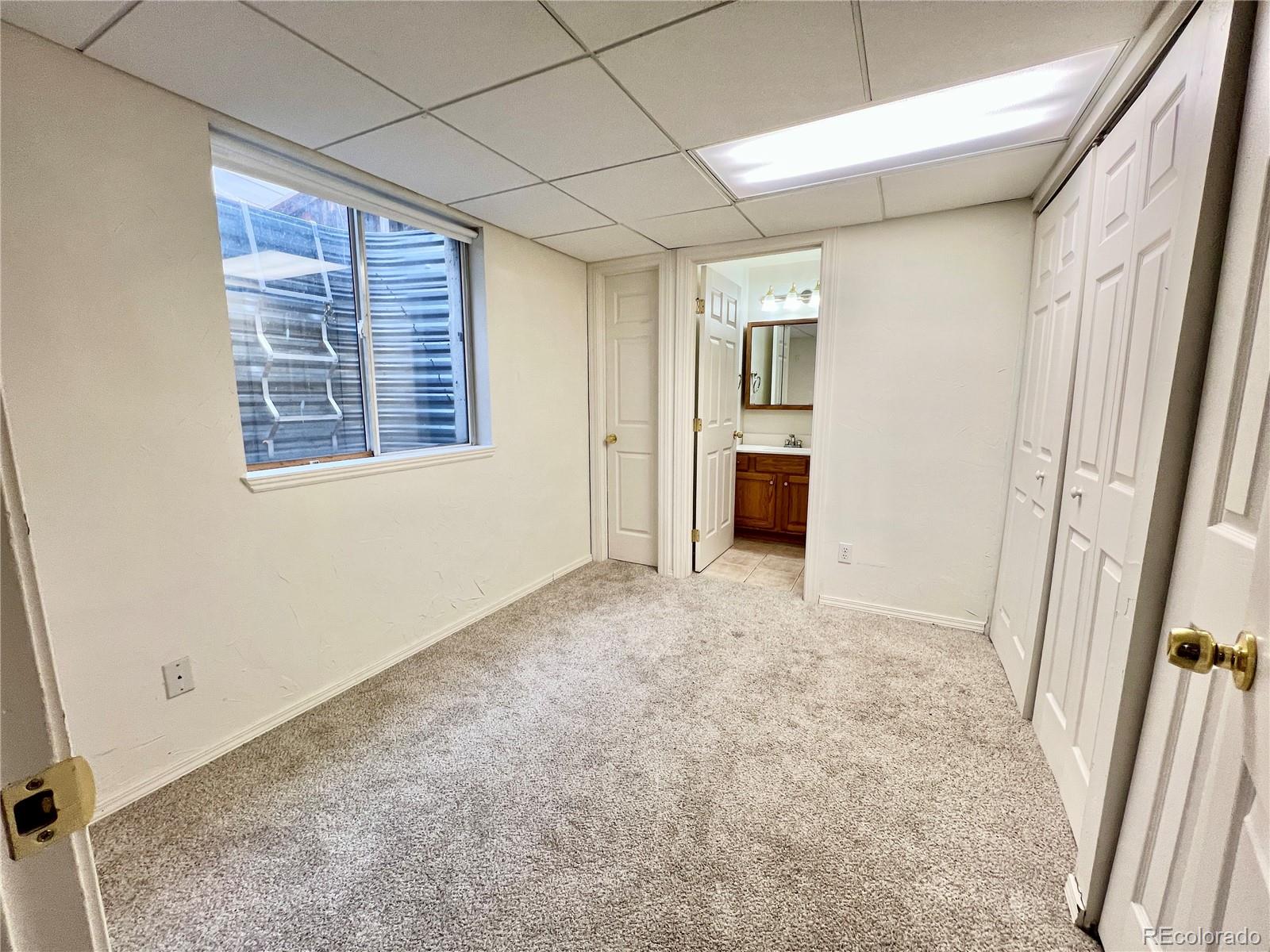 4927 Tarcoola Lane Highlands Ranch, CO 80130 - Photo 16 of 20 an empty room with windows