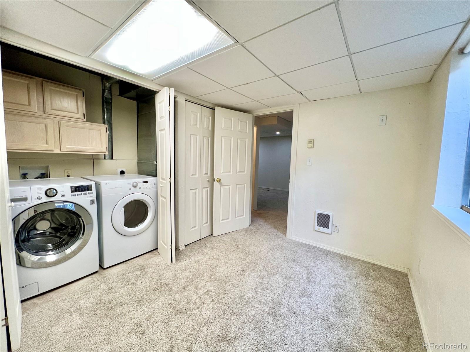 4927 Tarcoola Lane Highlands Ranch, CO 80130 - Photo 17 of 20 a utility room with dryer and washer