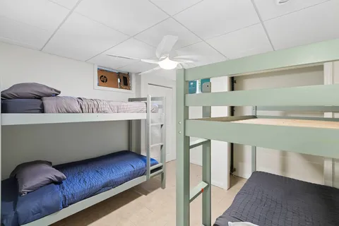 a living room with furniture and a chair