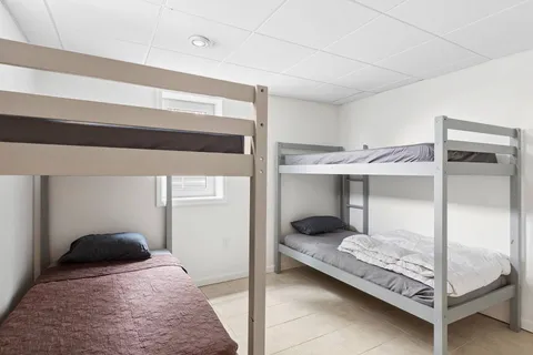 a bedroom with a bed and a walk in closet