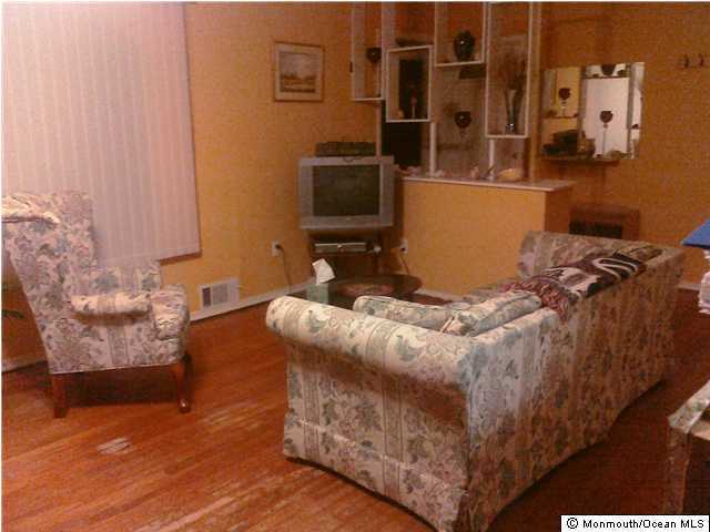 32 Mallard Road Bayville, NJ 08721 - Photo 3 of 3 a bedroom with a bed and a flat screen tv