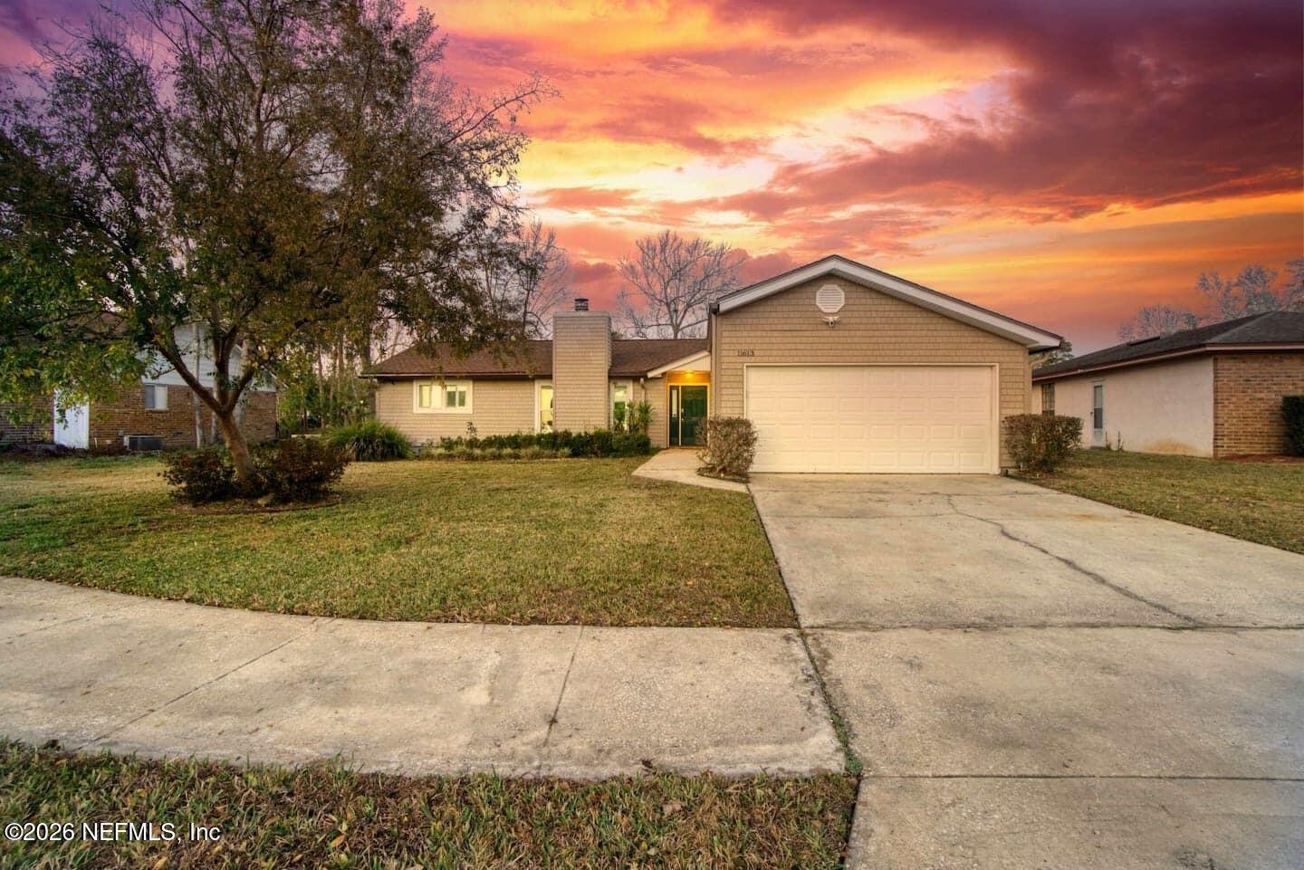 11613 Lake Ride Drive Jacksonville, FL 32223 - Photo 1 of 42 a view of a house with a yard