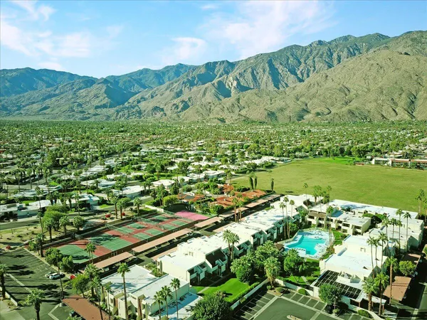 a view of a city with mountains in the background