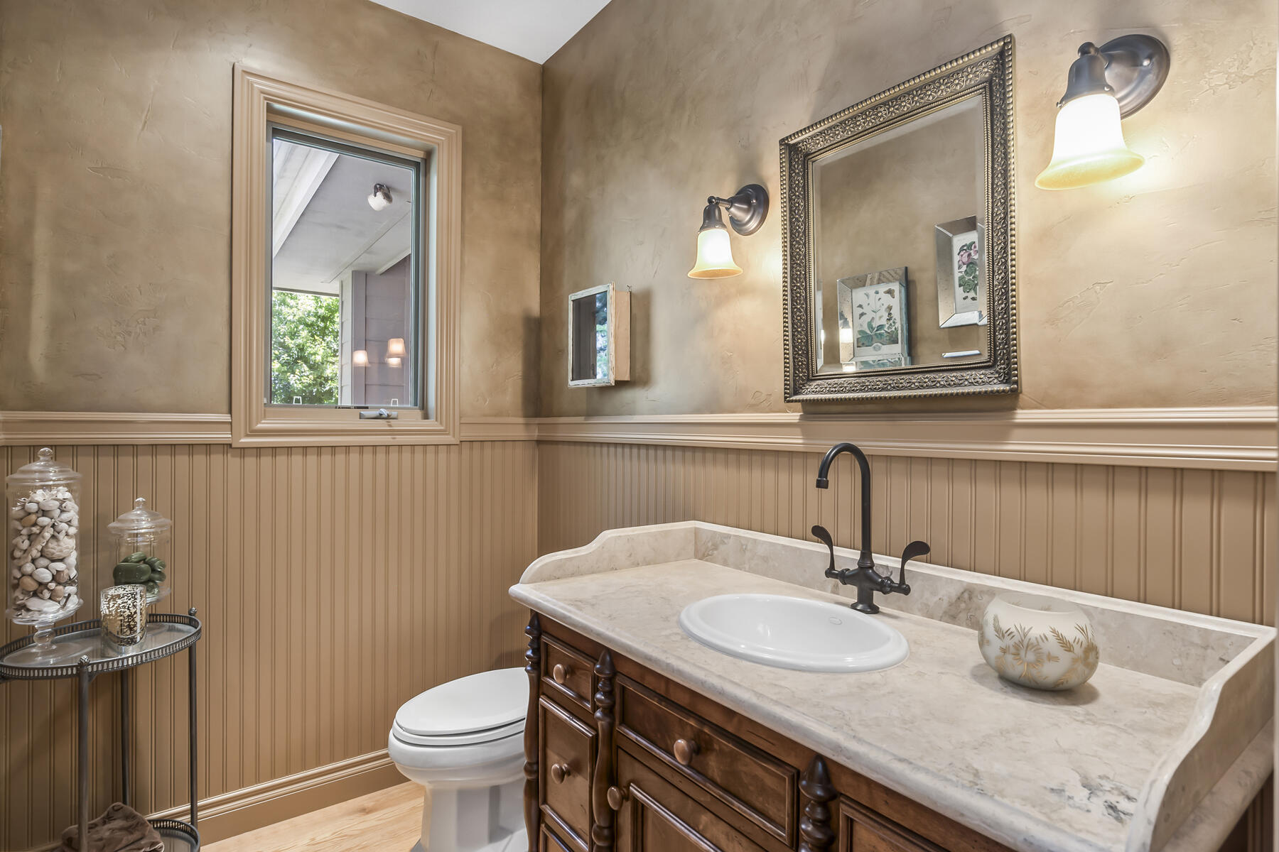 61445 Gosney Road Bend, OR 97702 - Photo 53 of 83 a bathroom with a granite countertop sink a toilet and mirror