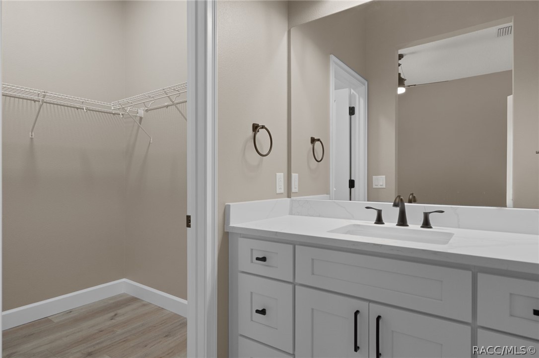 4530 South Florida Avenue Inverness, FL 34450 - Photo 31 of 100 a bathroom with a double vanity sink and mirror