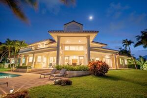 901 Southeast Riverside Drive Stuart, FL 34994 - Photo 12 of 53 a spacious bedroom with a large window and a yard