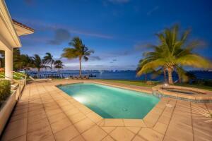 901 Southeast Riverside Drive Stuart, FL 34994 - Photo 14 of 53 a swimming pool with outdoor seating and yard