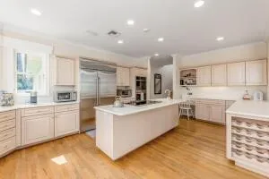 a bathroom with a double vanity sink toilet and a mirror