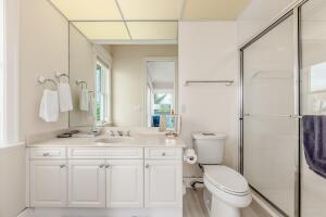901 Southeast Riverside Drive Stuart, FL 34994 - Photo 43 of 53 a bathroom with a sink toilet vanity and shower